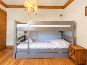 A bunk bed with a ladder, a small wooden dresser, and a hanging light fixture. - Charming apartment, parking - 6 guests (Champagny-en-Vanoise)