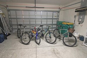 A garage with bicycles parked inside. - Waterfront Haven: SW Facing Pool and Spa #10 (Rotonda West)