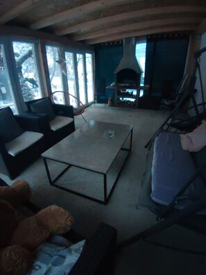 A living room with a fireplace, a sofa, and a coffee table. - Serene 6-bedroom house in Vrelo Koreničko perfect for groups (Vrelo Koreničko)