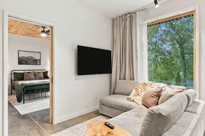 Living room with 55" smart TV for easy streaming - The Cardinal | Wooded Stay Near Downtown + Trails (Bentonville)