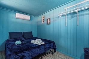 A room with a bed, a ceiling fan, and a wall-mounted air conditioner. - Llanos Costa by Otium (Cabo Rojo)