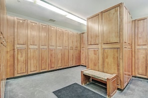 A locker room with wooden lockers, a bench, and a black mat on the floor. - Lake and Mountain Views. Center Village Gem. In unit washer and dryer! Steps fro (Copper Mountain)