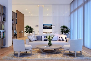 A modern living room with a sofa, two armchairs, a coffee table, and a bookshelf. - 5-Star Luxury Condo at Tiffany House -7th floor (Fort Lauderdale)