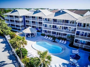 A hotel with multiple floors, a swimming pool, and outdoor seating areas. - ⭐Across St from Beach Access-Gulf Views-Pool+Hot Tub-Summer Breeze 310⭐ (Miramar Beach)
