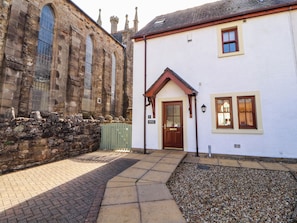 A building with a stone facade and a white exterior. - Derwent Cottage (Cockermouth)