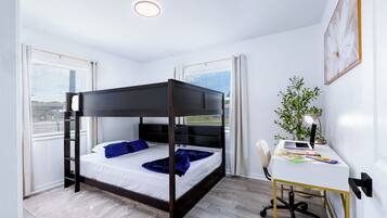 Een moderne slaapkamer met een hemelbed, een bureau met stoel en een raam met jaloezieën.