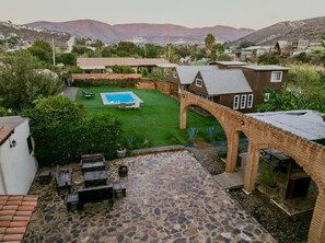 A residential property with a swimming pool, patio area, and a view of the surrounding landscape. - Hacienda Cuatro Milpas  Ensenada & Valle de Guadalupe (Ensenada)