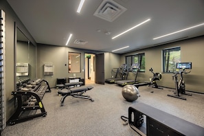 A gym with treadmills, exercise balls, and weight machines. - AMB107 | Newest Luxury Complex | Close to Gondola | Winter Shuttle | A/C (Steamboat Springs)