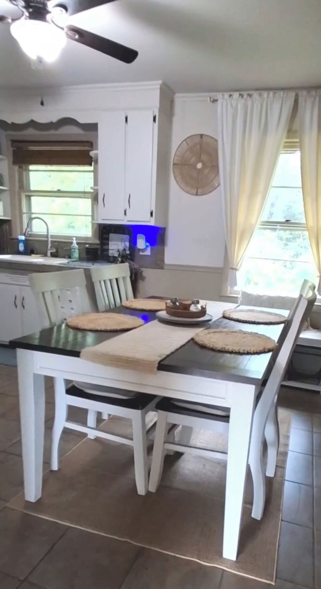 kitchen visible,  dining table, coffee maker,  stovetop, 