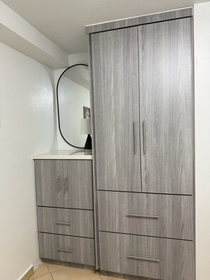A wardrobe with two doors, a mirror, and a small shelf. - Little Corner of Paradise Sleeps 6, 2 Bath, 2 Room (Rincon)