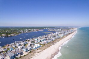 A coastal town with a marina, beachfront properties, and a clear sky. - Fabulous Beachfront 2-bedroom Condo on Carolina Beach (Carolina Beach)