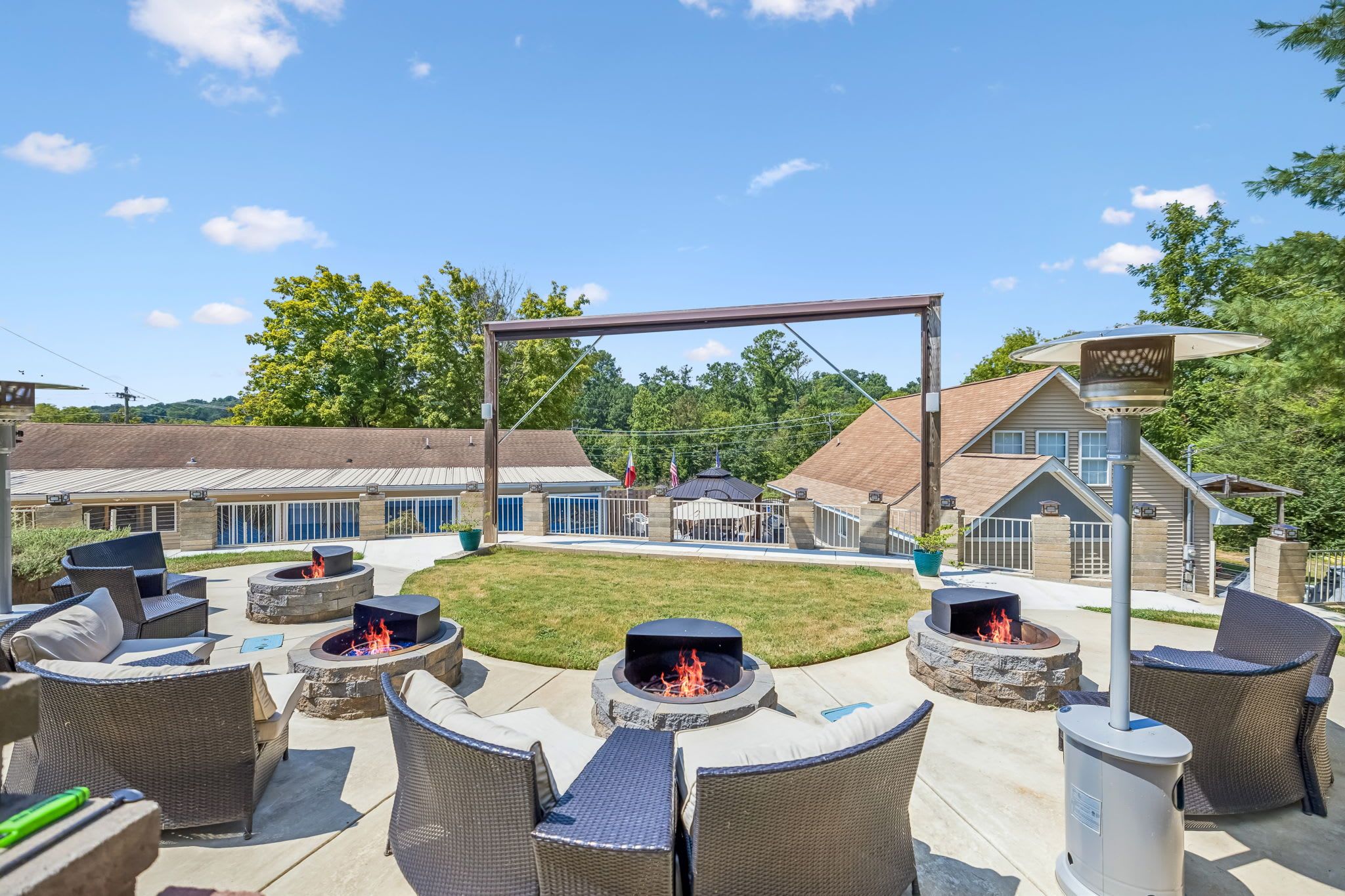 A patio area with outdoor seating and a fire pit.