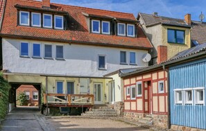 A traditional European-style building with multiple windows, a stone staircase, and a small bridge. - 2 bedroom lovely apartment in Röbel (Röbel)