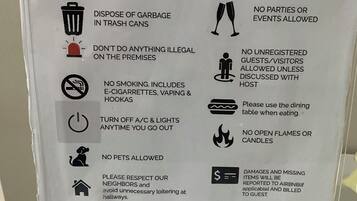 A list of house rules for a property, including no shoes inside, no smoking, and no pets allowed.