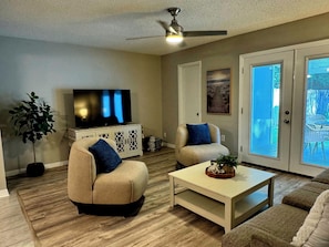 interior, indoor, climate control, couch, living area, 58" smart TV