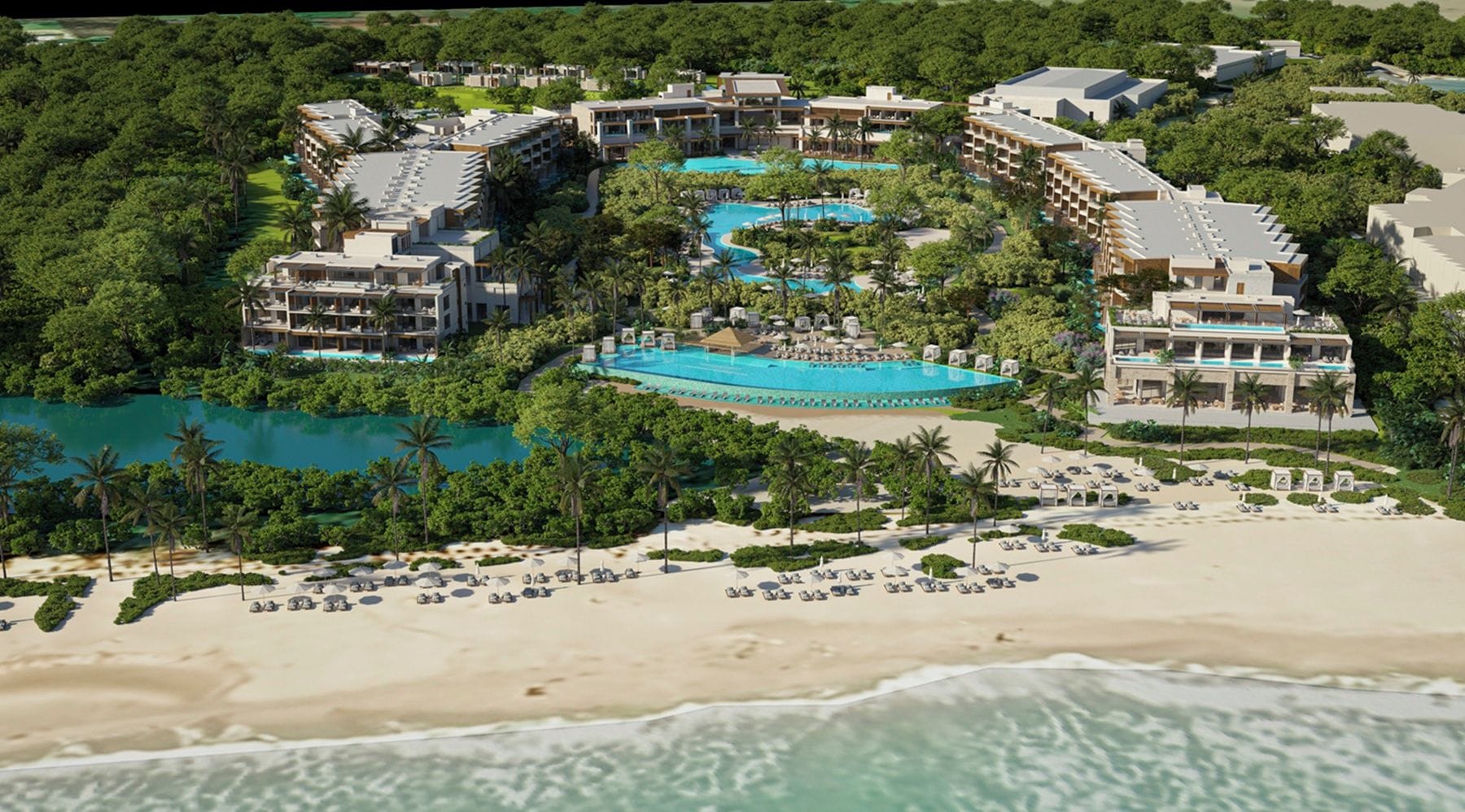 A resort with multiple buildings, a large central pool, and a beach area.