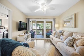 Cozy living room w/ smart TV, sleeper sofa & balcony access - 2BR Condo for 6 w Balcony Overlooking Shared Pool! (Hilton Head Island)