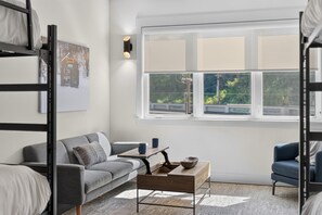 Lounge area with big windows - Rendezvous Loft · Bunk Studio Above Bike Shop (Bella Vista)