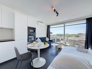 Interior Design, Apartment, Furniture, Ceiling, Chair, Television, Hotel, Cabinetry