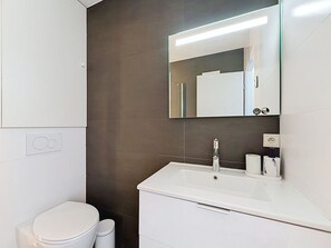 Bathroom, Interior Design, Flooring, Plumbing Fixture, Wall, Floor, Bathroom Sink, Mirror, Cabinetry, Bathroom Cabinet