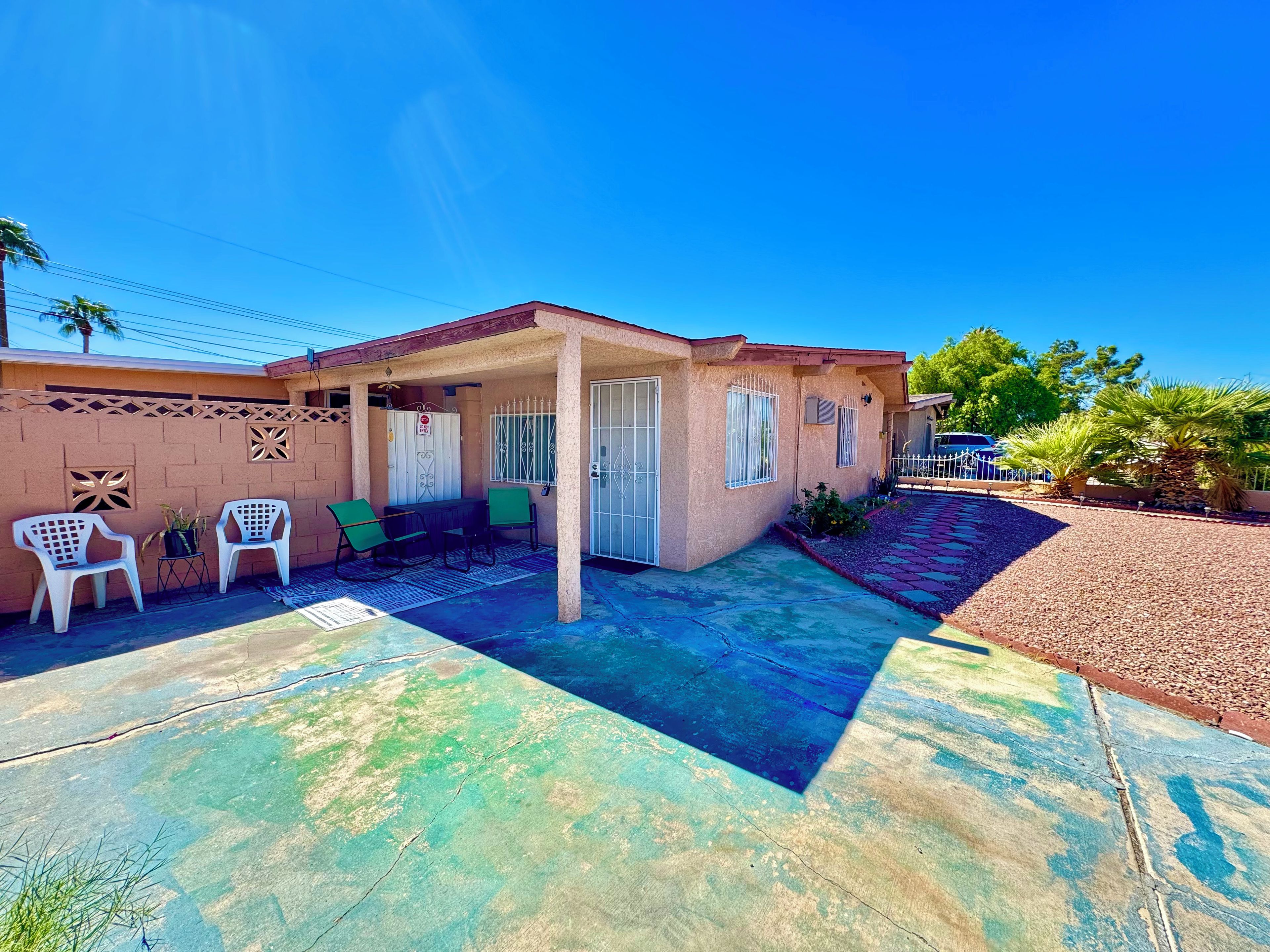 Covered front patio with seating, private entry, and easy parking