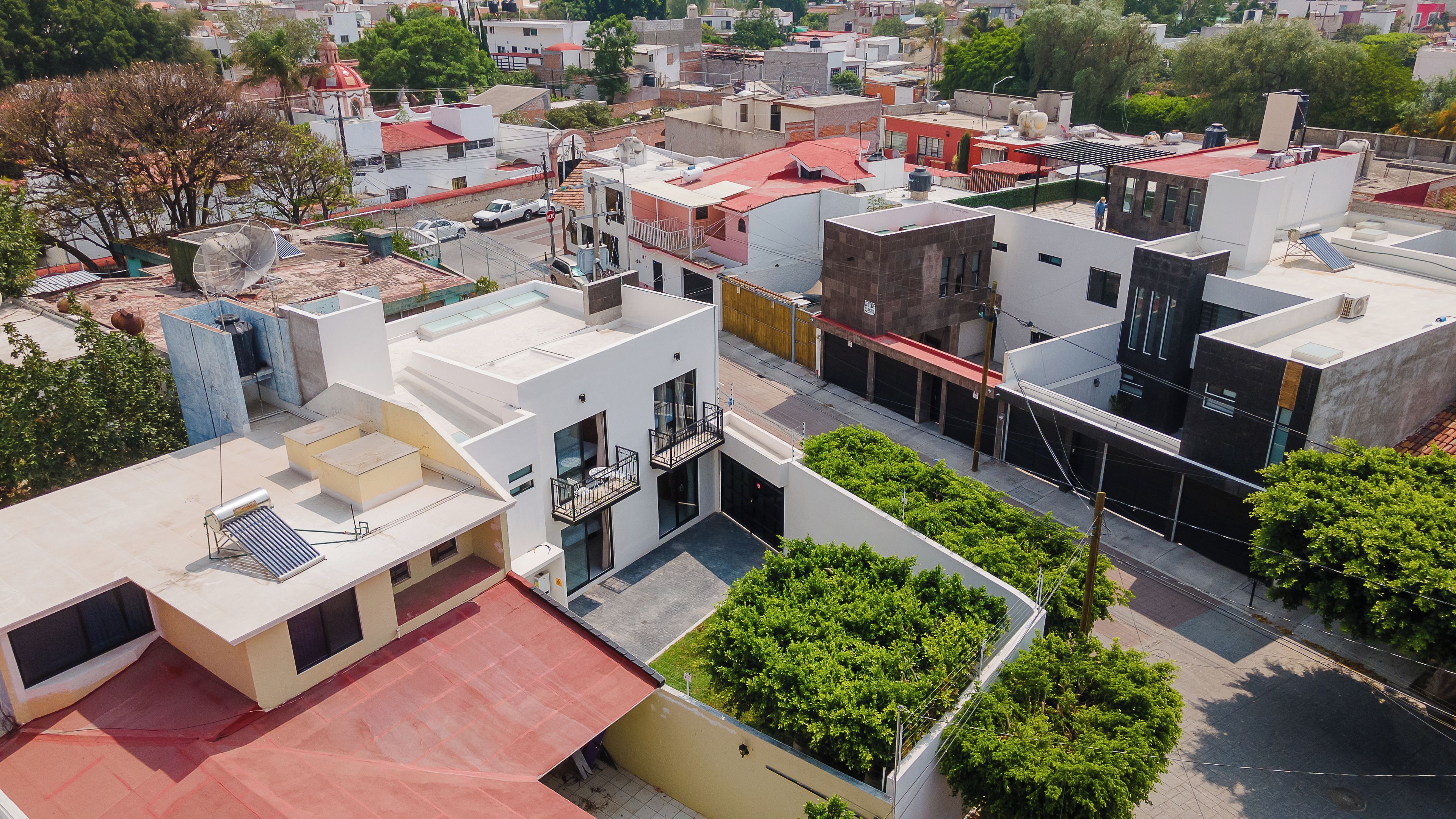 A modern urban area with various buildings, including a mix of residential and commercial structures.