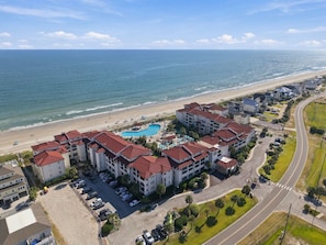 A coastal hotel with a swimming pool, beach access, and a parking area. - Ocean Views, Pools Hot Tub & Beach @Villa Capriani (North Topsail Beach)