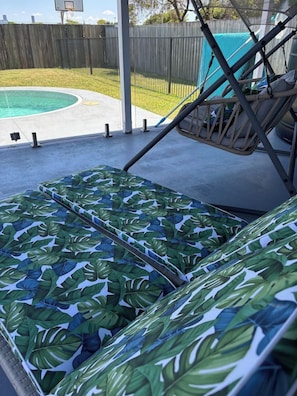 A poolside area with a hammock and a pool. - Charming 3 Bdrm Parkside Qlder w Fabulous Deck. (Windsor)