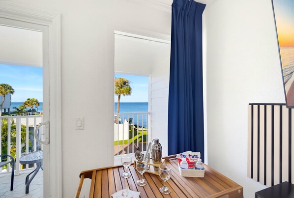 Coastal bar cart with private balcony and bay views