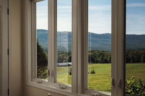 Watch the light move across the pasture and ridge from the sunroom windows, coffee in hand.