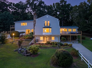 A two-story house with a covered porch and a landscaped front yard. - Cedar Vista | Mt. Yonah Views & Pool Table (Sautee Nacoochee)