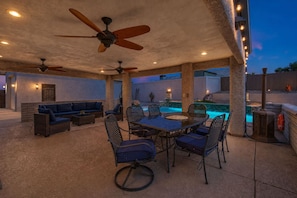 An outdoor patio with a pool, seating, and ceiling fans. - Havasu Sahara - Pool, BBQ, Cozy Living Space (Lake Havasu City)