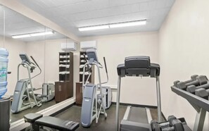 A fitness center with treadmills, a stationary bike, and free weights. - Pittsburgh Area Retreat | King Suite, Sleeper Sofa & Full Kitchen (Cranberry Township)