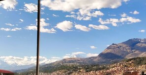 A mountainous landscape with a town in the foreground and a prominent peak in the background. - 4 bedrooms · View of the Cordillera Blanca · La Soledad (Huaraz)