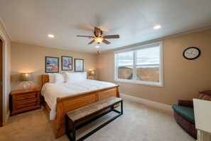 A bedroom with a bed, a ceiling fan, a window, a clock, and artwork on the wall. - Resort Center 5052 | Ski-In/Ski-Out | Pool & Hot Tub Access | Mtn View Deck | Fireplace | A/C (Park City)