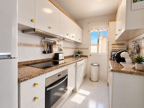 Private kitchen - Upper-floor bungalow with private solarium and community pool in San Luis (El Chaparral)