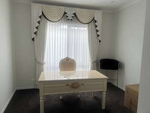 A room with a white desk, a chair, and a large window with sheer curtains. - Bonnie brook retreat (Bonnie Brook)