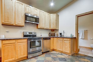 A kitchen with wooden cabinets, a microwave, stove, oven, and dishwasher. - Retreat 7 Mi to Northstar Skiing! Easy I-80 Access (Truckee)