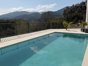 A swimming pool with a view of mountains.