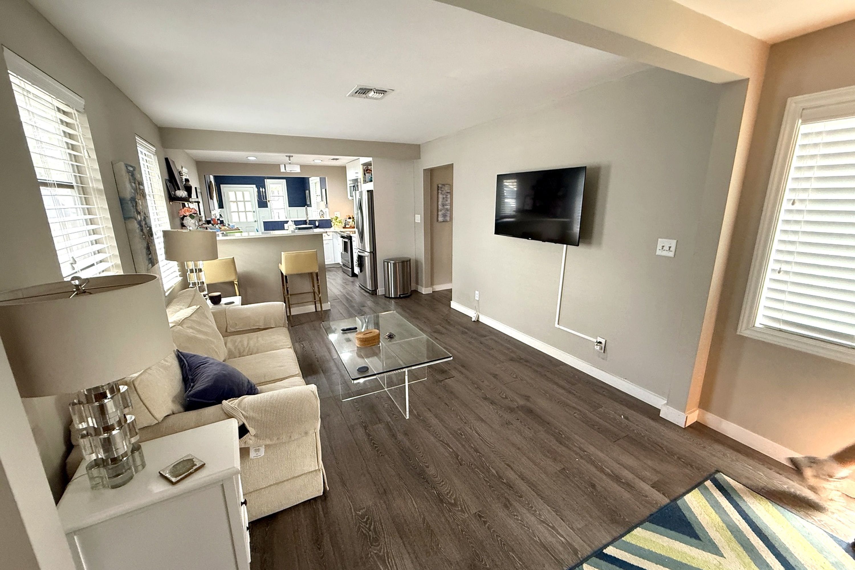 Open-concept living space flows into the kitchen and breakfast bar—perfect for settling in and feeling at home.