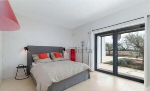 Bright modern bedroom with large glass doors and serene garden views - *VillaMONiKA | Luxury Trulli & Pool by TrulloVista (Martina Franca)