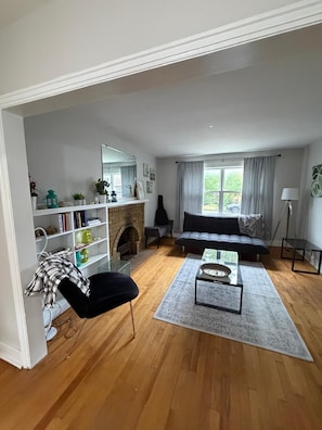 A living room with a fireplace, a sofa, a coffee table, and a bookshelf. - Welcome home ! 
West end of Halifax, 3 bedroom home is waiting for you! (Halifax)