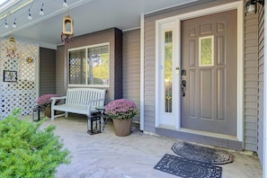 A porch with a bench, potted plants, a door, and a window. - Indianapolis Escape, Easy Access to Dtwn! (Indianapolis)