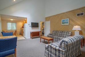 A compact living space with a kitchenette, a sofa set, a dining table, and a television. - Retreat 2 Mi to Cape Cod Beaches! Bring Your Pets (Mashpee)