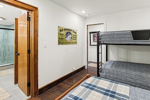 Guest bedroom with full bed and twin-over-twin bunk bed (lower level). - New! FOREteener’s Retreat | AC, Pool, Hot Tub, Golf & Ski (Durango)
