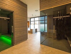A modern interior with a glass door labeled 'DAMPERBAD 55°' and a glass wall with 'FINNISCHE SAUNA 90°' signage. - Sunny Suite With 2 Bedrooms in Borgerende (Boergerende-Rethwisch)