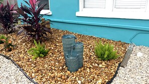 Tropical landscaping and a garden fountain right outside the cottage. - Private 1BR Garden Cottage | 1 Mi to Madeira Beach (St. Petersburg)