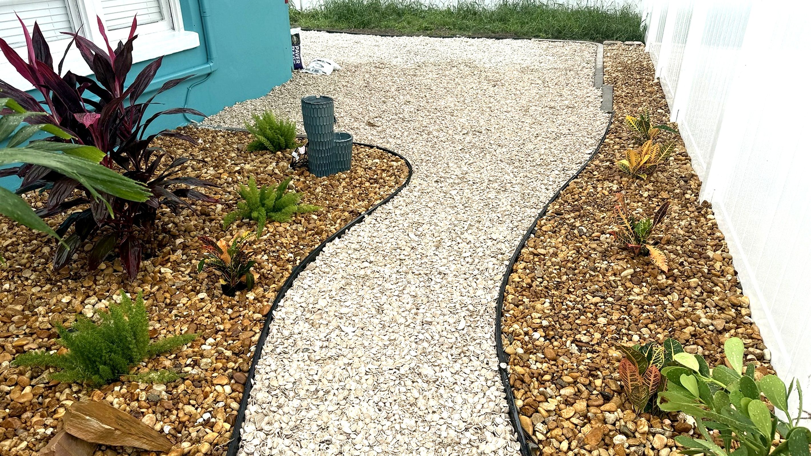 Garden path winding through tropical plants to your private cottage.