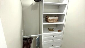 Large closet with shelves, drawers and hanging space — great for longer stays. - Private 1BR Garden Cottage | 1 Mi to Madeira Beach (St. Petersburg)