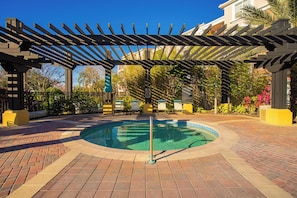 A pool area with a pergola, lounge chairs, and a no diving sign. - Spacious 3BR condo, Perfect Orlando Home Base (Orlando)